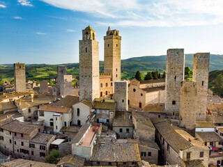 Obraz premium Aerial view of famous medieval San Gimignano hill town with its skyline of medieval towers, including the stone Torre Grossa. UNESCO World Heritage Site.