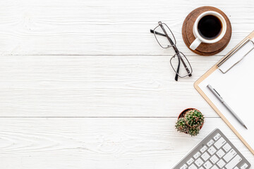 White office working place with computer and cup of coffee