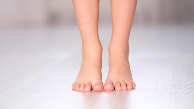 child rolls from heel to toe. Prevention of flat feet in children. Exercises for the legs. Flat feet physical therapy. close up