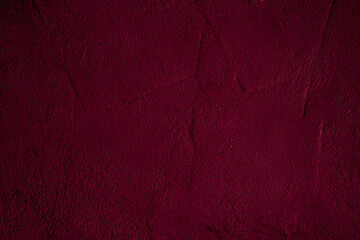 Crimson colored wall background with textures of different shades of crimson red