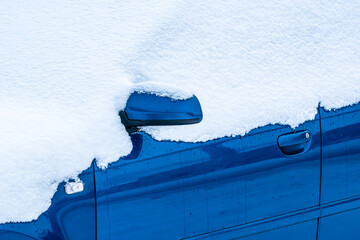 Side of a snow covered car