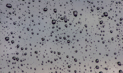 Water drops on a glass surface with shallow focus