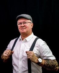 portrait of a man with cap and tattoo's