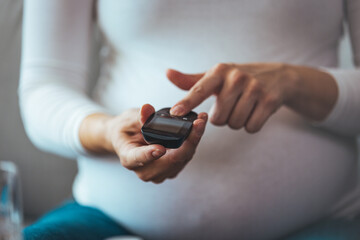 Diabetes monitoring with blood sugar test, glucose measurement on aged woman patient fingertip for analyzing insulin-deficient illness, diabetic disease awareness and control