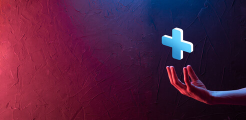 Businessman hold 3D plus icon, man hold in hand offer positive thing such as profit, benefits, development, CSR represented by plus sign.The hand shows the plus sign