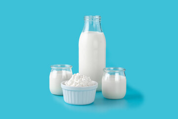 Milk kefir drink on wooden table. Liquid and fermented milk product on blue background	