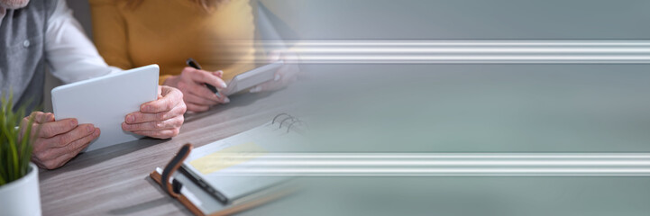 Coworkers working together; panoramic banner