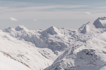 Fototapeta na wymiar Winter views on snow-capped mountains in the Swiss Alps