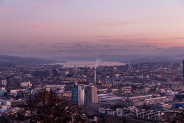 Fototapeta na wymiar Panorama View of City Zurich at Pink and Violet Sunset