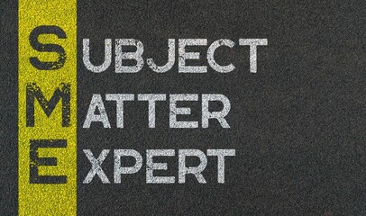 Subject matter expert - SME acronym written on yellow line paint of asphalt - obrazy, fototapety, plakaty