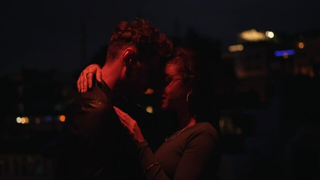 couple hugging in the evening city