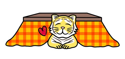 A cute tiger smiling and lying in the kotatsu. Kotatsu is a Japanese winter furniture with a low table,an electric heater and a blanket.