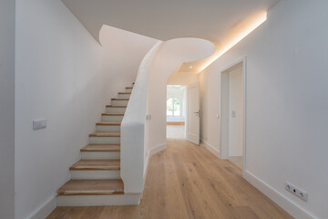 Entrance hall with rounded stairs