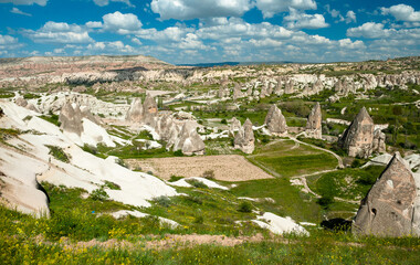 Fototapeta na wymiar Goreme landscape from Cappadocia area in Turkey during a sunny summer day with blue sky and white clouds