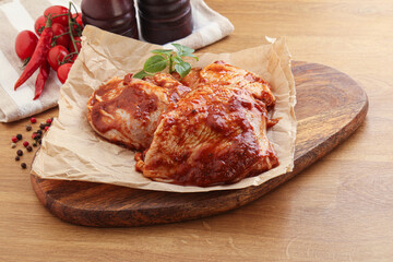 Marinated chicken leg in tomato sauce
