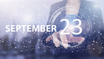 September 23rd. Day 23 of month, Calendar date. Hand click luminous hologram calendar date on light...