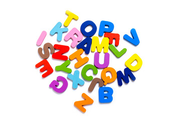 Obraz premium English alphabet made of square wooden tiles with the English alphabet scattered on white background.