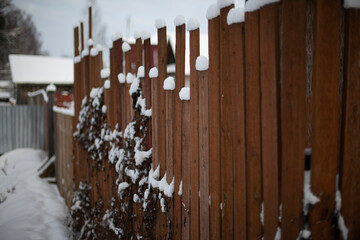 snow covered fence