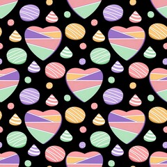 Seamless pattern with candies, cakes, donuts and macaroons
