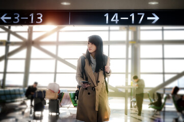 woman traveler passenger in motion of urgent hurry to findout the gate way teminal to check-in...