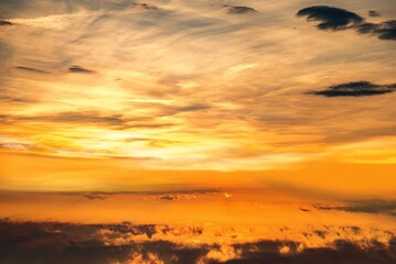 Fototapeta na wymiar Sunset in the clouds sky. 