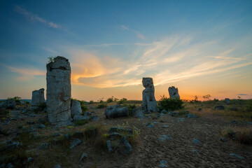 Obraz premium Beautyful sunrise over The Stone Desert Pobiti Kamani - fabulous rock phenomenon in Varna Province, Bulgaria - tourist destination