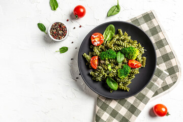 penne pasta with spinach with cherry tomatoes. proper diet. Clean eating, dieting, vegan food...