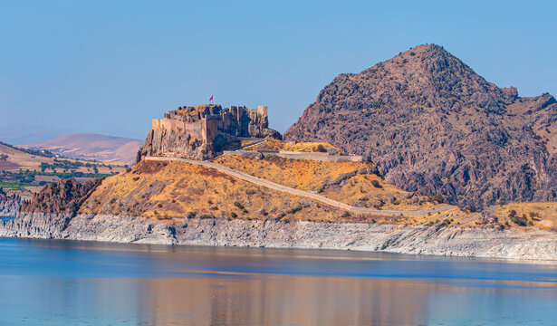 Pertek castle located in Pertek district of Tunceli - Pertek, Turkey Keban dam lake in the foreground