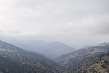 Obraz premium view of the mountains with snow and fog
