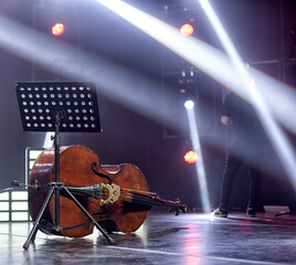 Fototapeta premium Musical instruments - two double bass or contrabass are in the orchestra room. In pending of the musicians before the rehearsal.