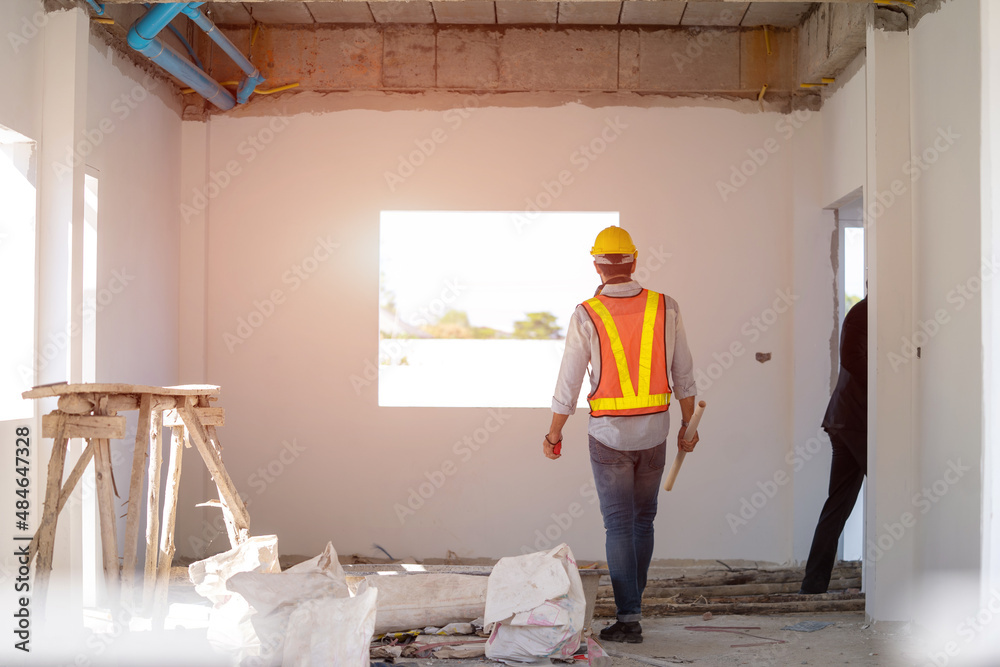 Poster Engineer working with foreman about project in building construction site,Construction project concept.