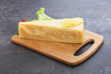 Parmesan cheese piece over board