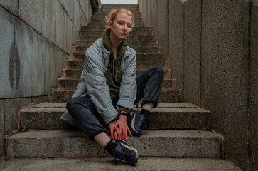 Woman posing on stone stairs