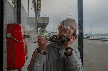 Girl in a telephone booth