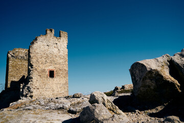 Fototapeta na wymiar Ancient Genoese fort. The loophole of the old fort.