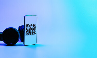 Qr code technology. Mobile smartphone screen for payment, online pay, scan barcode technology with qr code scanner on digital smart phone on neon background. Mobile phone application to scan code.