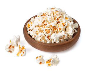 Popcorn in the wooden bowl, isolated on white background.