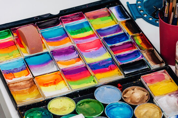 A set of multi-colored paints for body painting