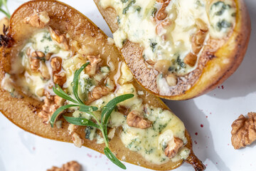 Pears baked with blue cheese, nuts and honey. French cuisine. Keto diet. Vegetarian lunch. banner, menu, recipe place for text, top view