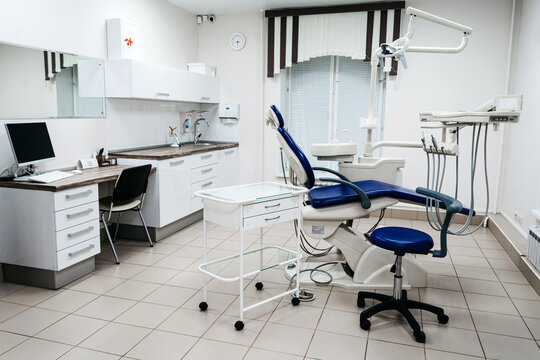 Light empty dental office with medical equipment