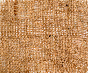 Burlap texture, a coarse, durable fabric made from thick yarns of intertwined threads.