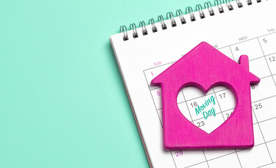 Moving day. House with a heart on the calendar. Template Copy space for text. mock-up