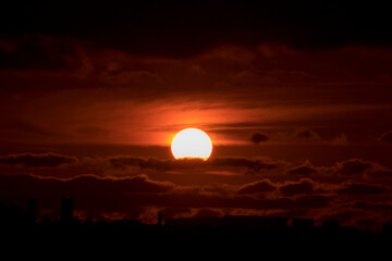 sun sitting in the clouds