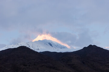 Snow-capped mountain peaks illuminated by dawn in manaslu Himalayas