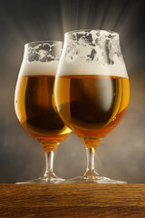 Two Glass of light beer on wooden table and dark background. Shallow depth of field	