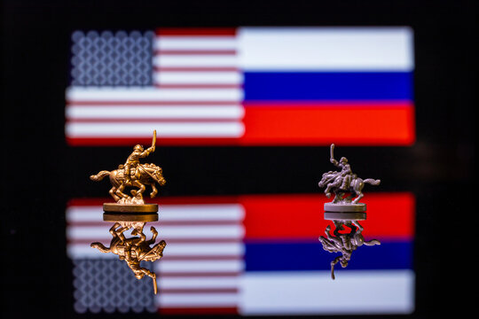 Conceptual image of war between United States and Russia using toy soldiers and national flags