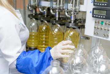 Sunflower oil factory. Factory line of production and filling of refined oil from sunflower seeds.