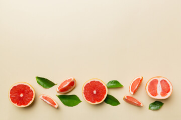 fresh Fruit grapefruit with Juicy grapefruit slices on colored background. Top view. Copy Space. creative summer concept. Half of citrus in minimal flat lay with copy space