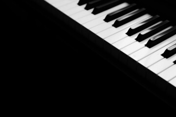 Background music, black and white piano keys in the dark