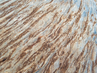 selective focus on rocks close up Beautiful pattern, looks strong. gray stone background with brown pattern caused by soil rock in nature
